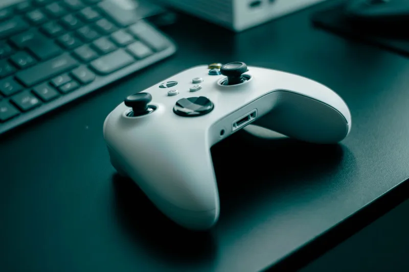 Game controller illustration with upward growth chart representing YouTube gaming channel growth