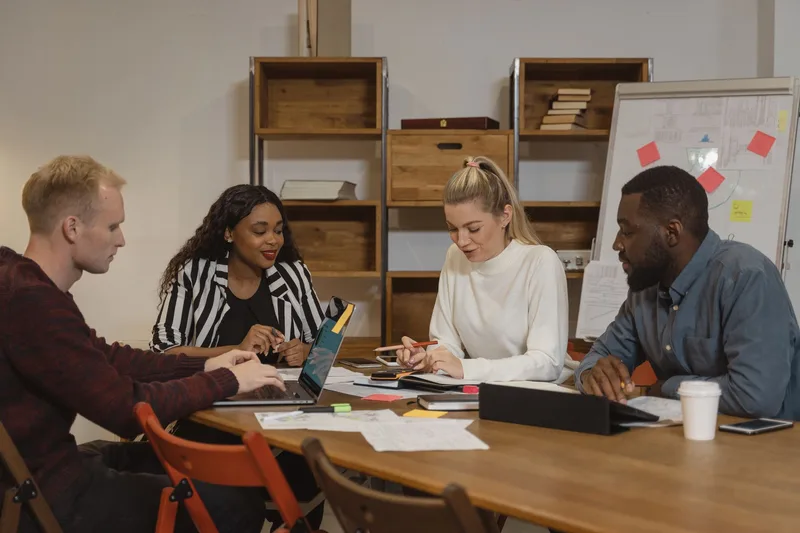 Multicultural team in a modern office engaged in a collaborative meeting
