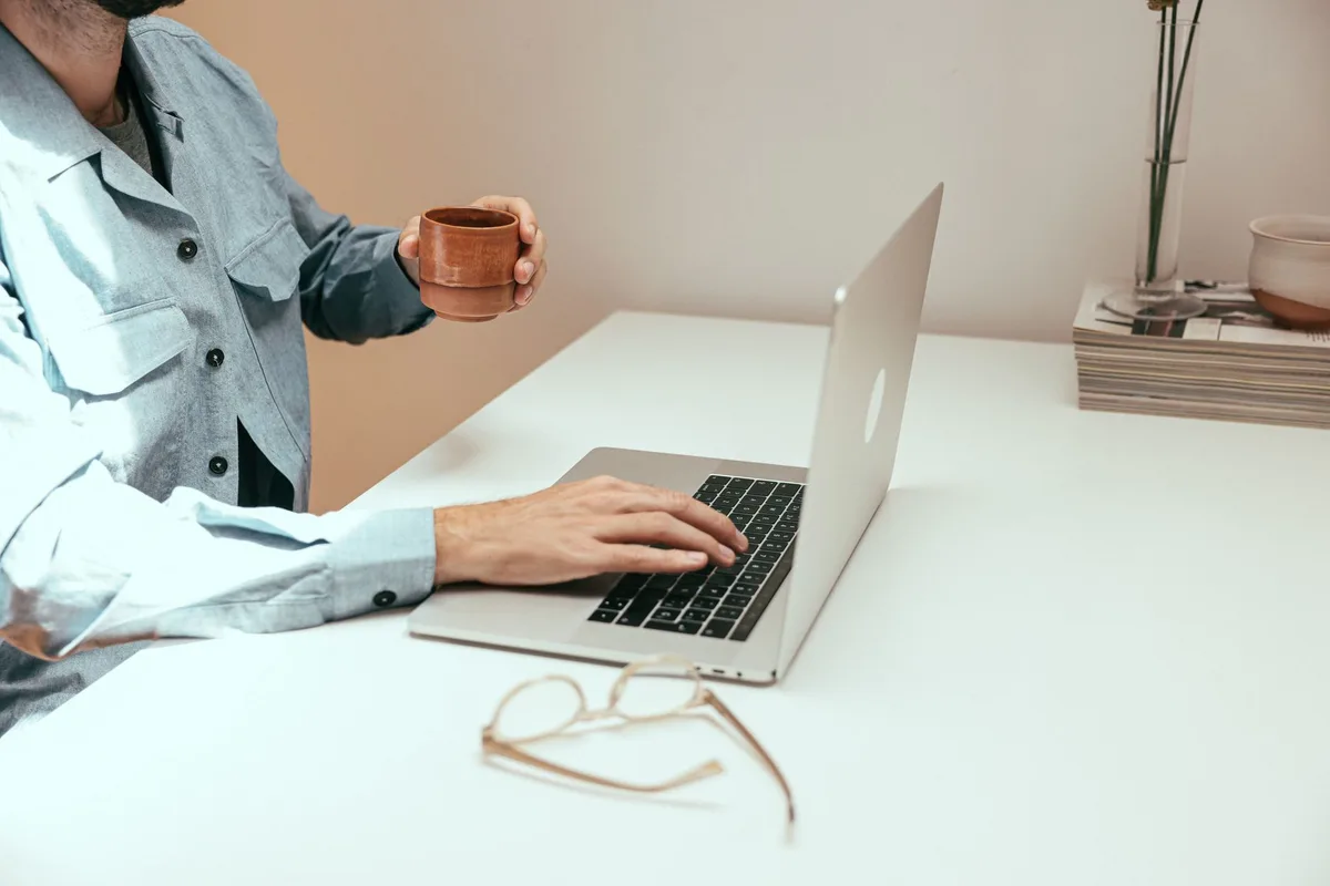 Small business owner setting up a Facebook Business Page on a laptop