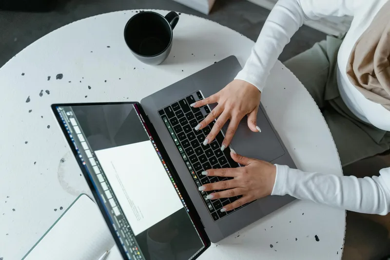Laptop on a clean desk with email analytics on screen representing the social-to-email conversion process