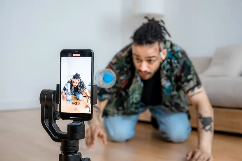 Content creator filming with a phone on a gimbal